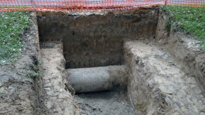 trenching exposing a 24" unmarked water main
