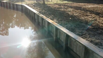 wooden bulkhead construction replacement wall on lake houston