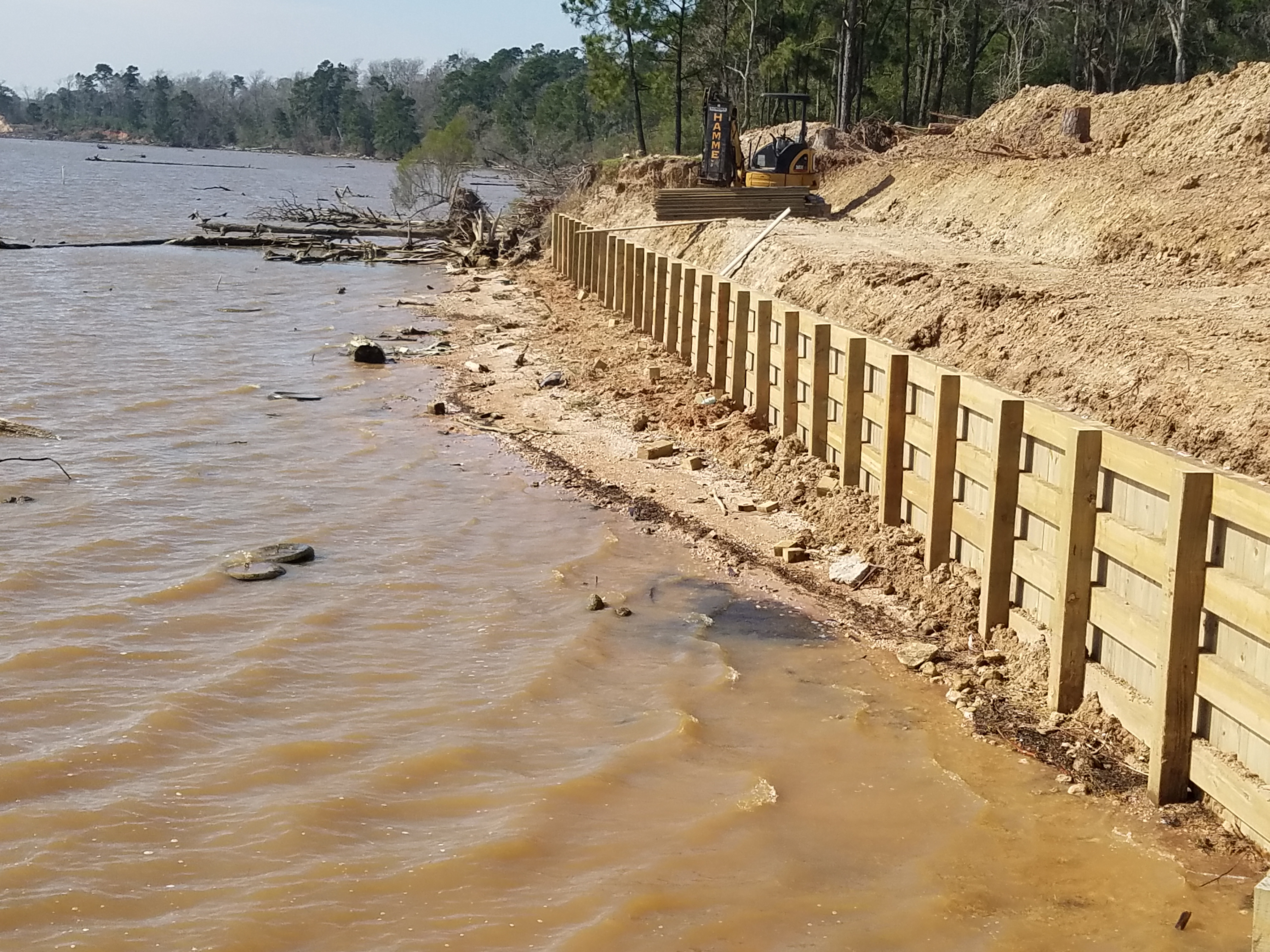 wooden bulkhead construction in lakeview on lake houston