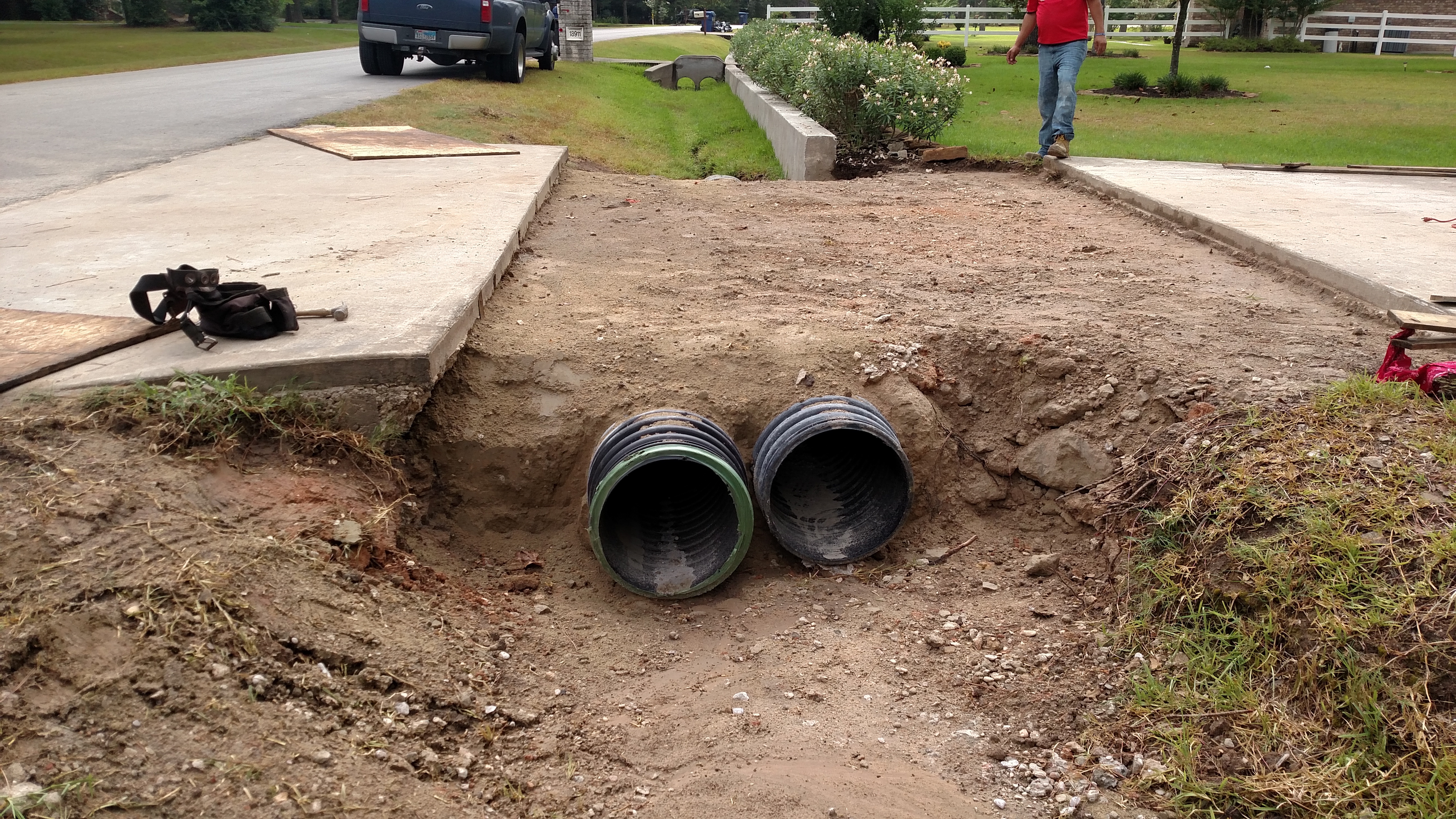 concrete and demolition driveway pour twin culverts