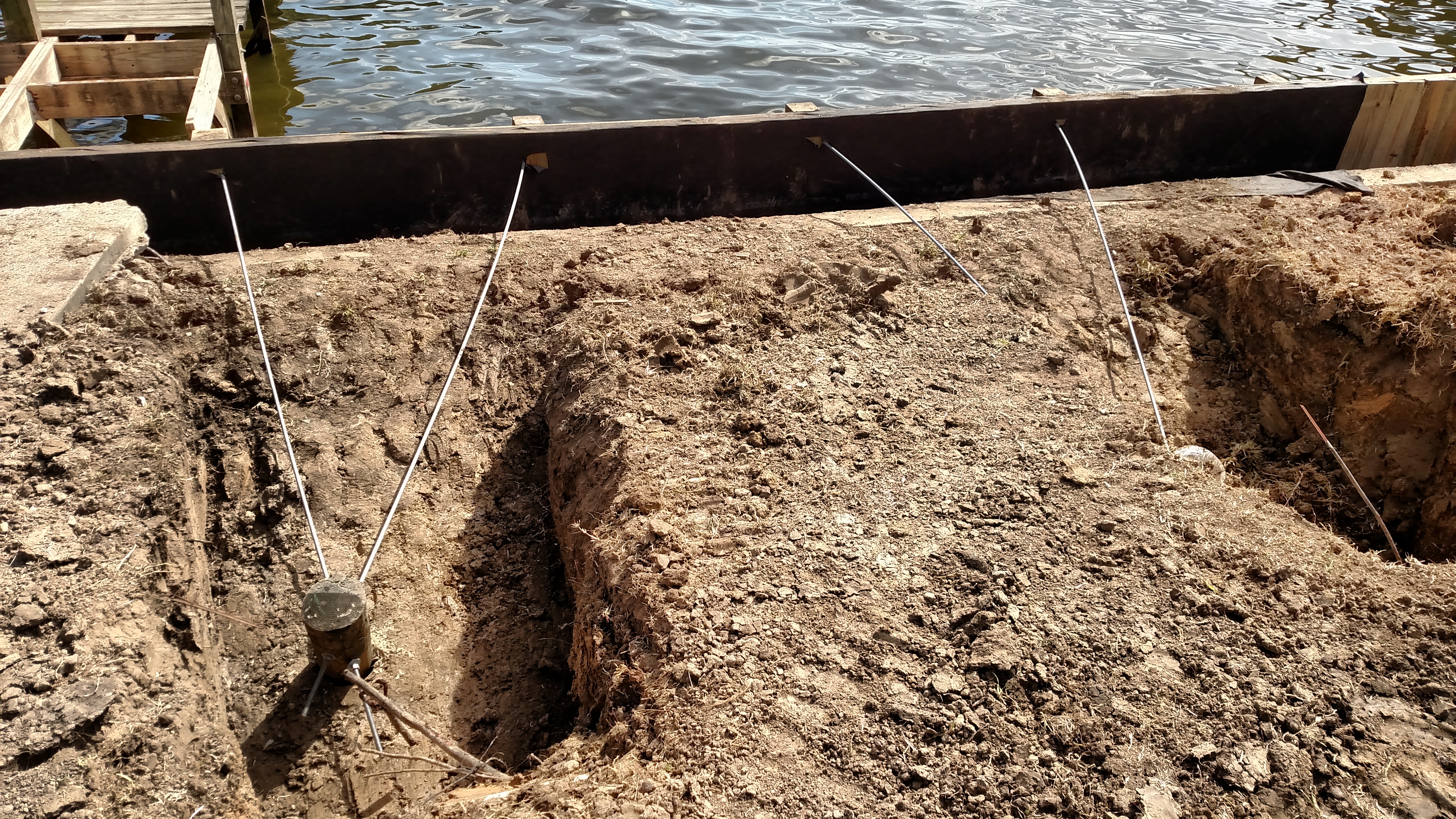 dead man installation on new bulkhead construction on lake houston