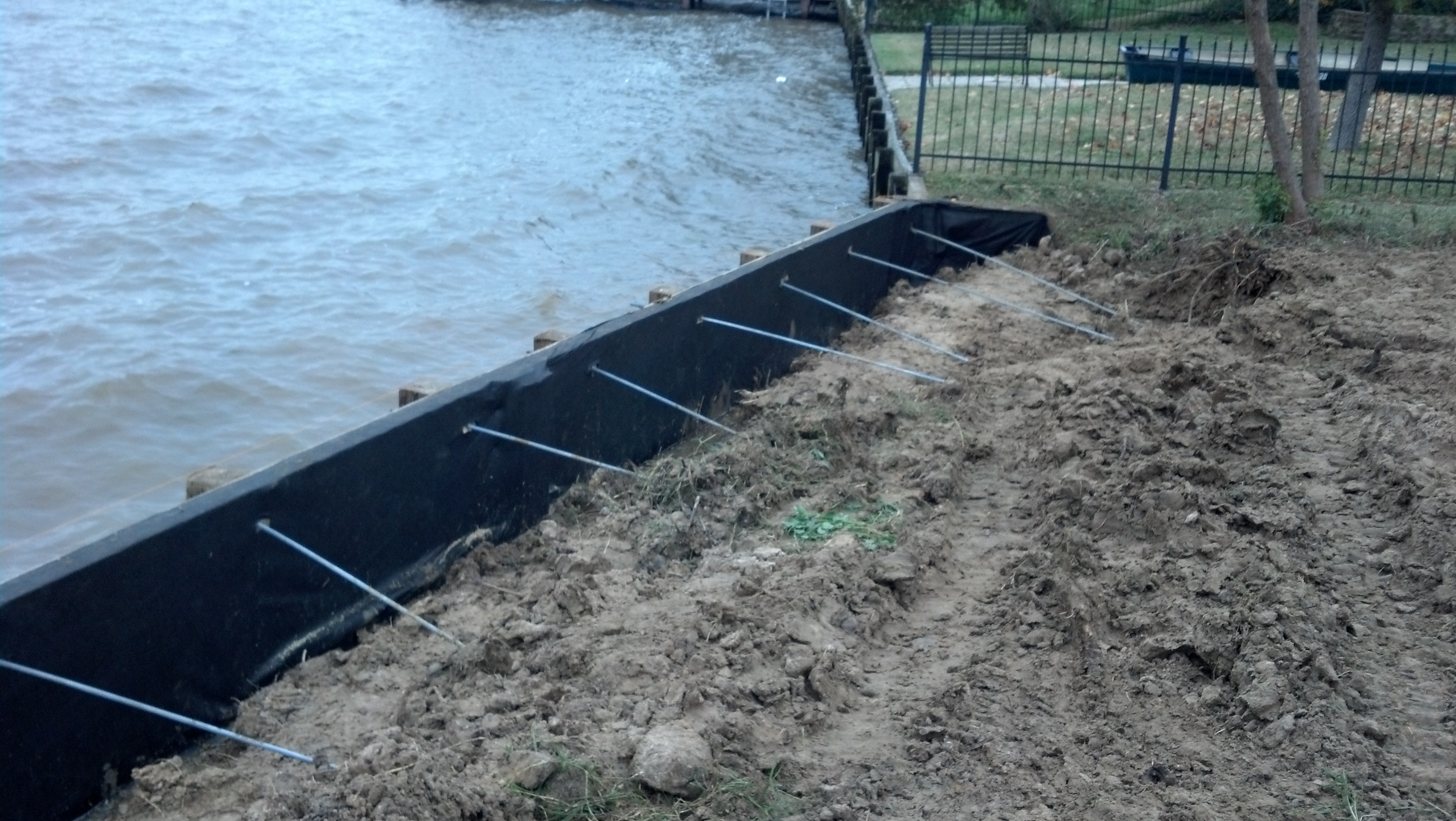 tie rods installed behind new bulkhead construction on lake houston