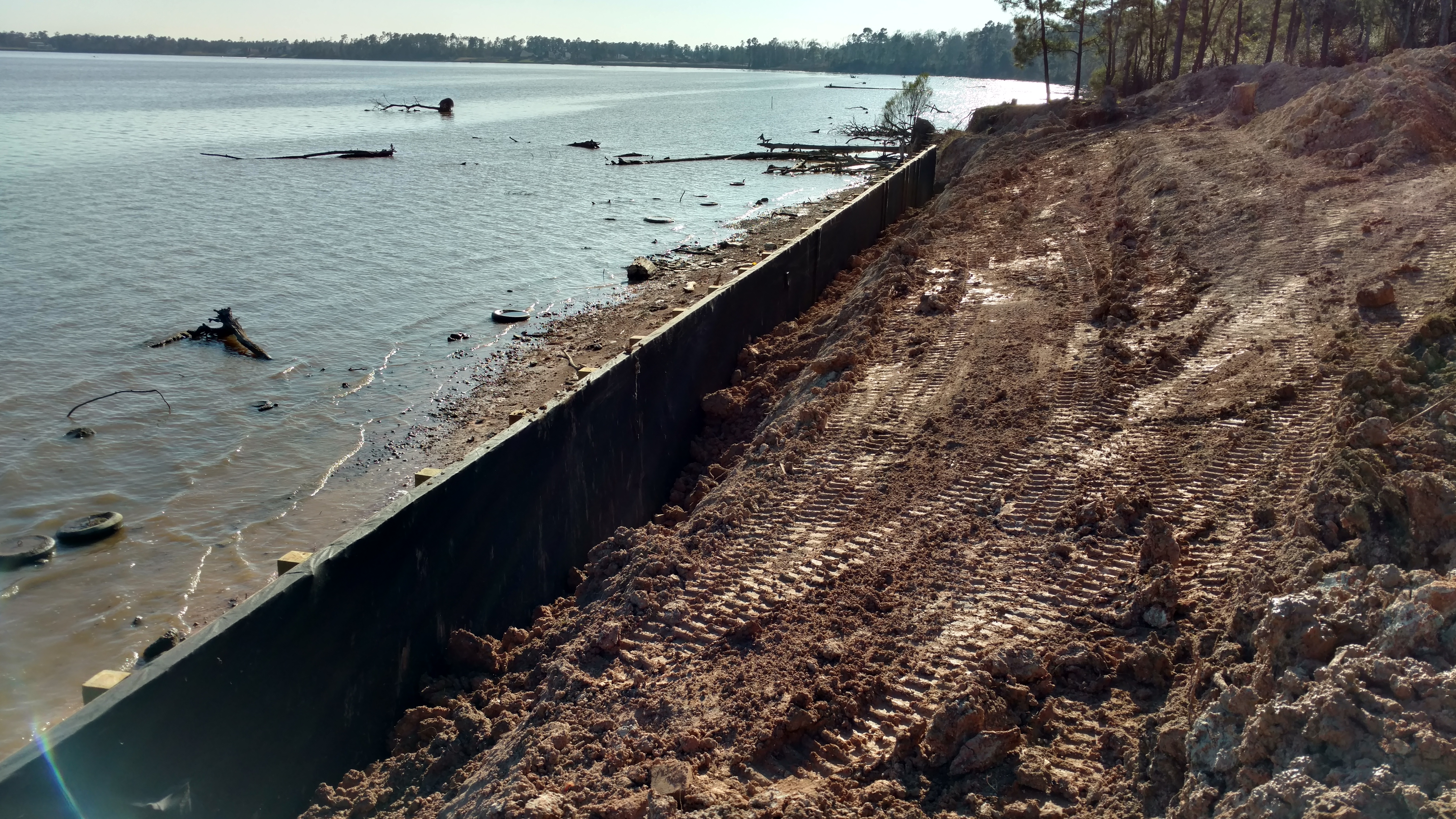 filter fabric installed behind new bulkhead construction on lake houston